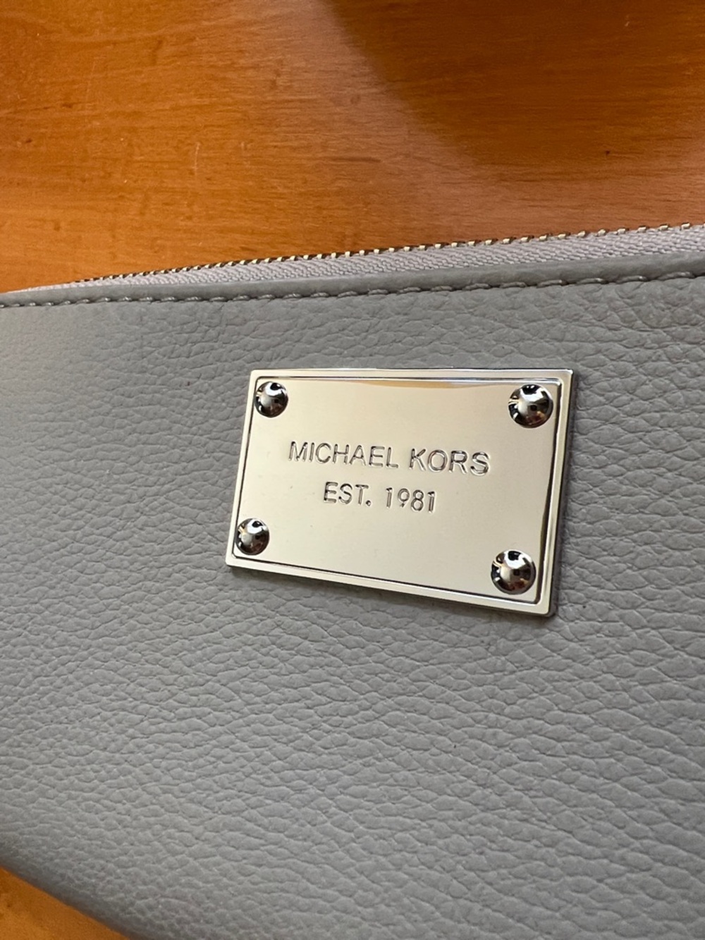 Michael Kors Pale Gray Pebbled Zip Wallet with Silver Plaque